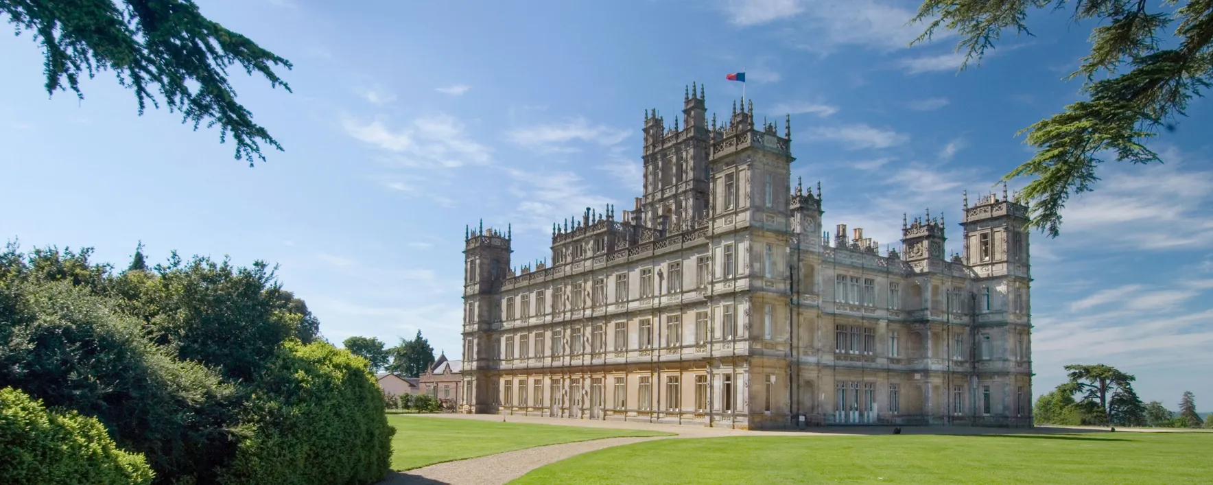 Historic castle with lush green surroundings
