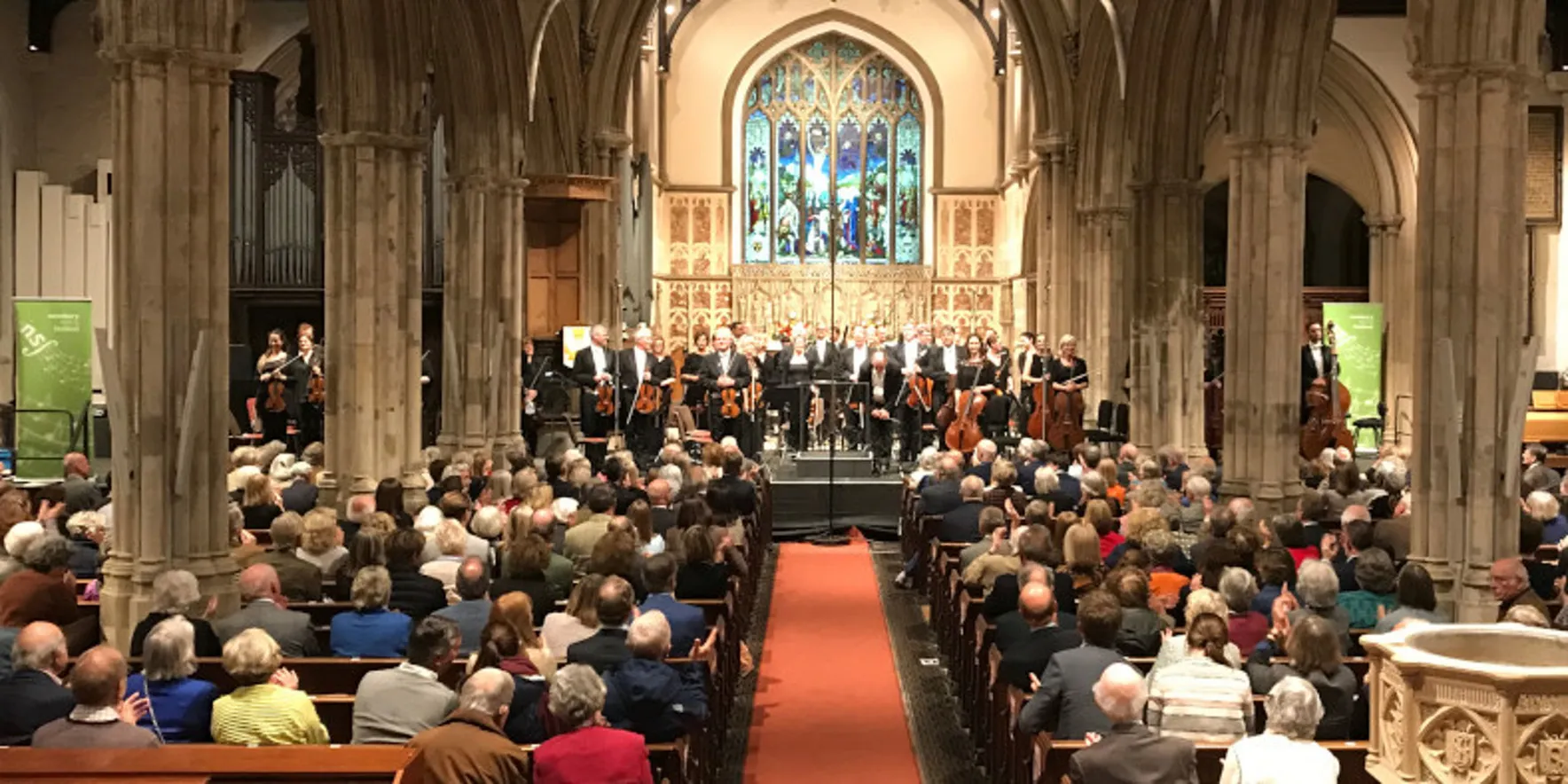 Orchestra performance in historic church setting